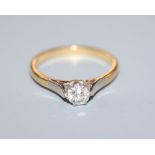 A diamond solitaire ring, '18ct and plat' setting, gross 3 grams, size O.