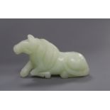 A Chinese jade figure of a recumbent horse length 7cm