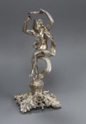 An early 20th century Austro Hungarian? white metal mount, modelled as maiden with a tambourine,