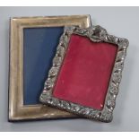 A late Victorian repousse silver mounted photograph frame, Birmingham, 1900 and a modern silver