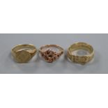 A 9ct gold 'belt' ring, a 9ct gold signet ring and a 9ct gold and ruby knot ring (central stone