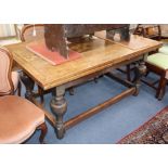 An oak drawleaf refectory table 256cm extended