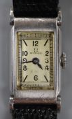 A lady's stainless steel Omega manual wind rectangular cased wrist watch, on later associated