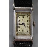 A lady's stainless steel Omega manual wind rectangular cased wrist watch, on later associated