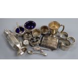 An Edwardian silver sugar caster, silver trinket box, silver salts, napkin rings, cigarette case and