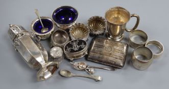 An Edwardian silver sugar caster, silver trinket box, silver salts, napkin rings, cigarette case and