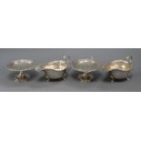 A pair of George V silver tazze with pierced gadroon and shell rims and a pair of silver sauceboats,