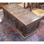 A 19th century carved oak coffer W.125cm