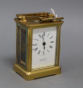 A Eustance & Co brass carriage timepiece with key