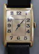 A gentleman's 14k yellow metal Longines manual wind wrist watch, with rectangular Arabic dial, on