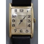 A gentleman's 14k yellow metal Longines manual wind wrist watch, with rectangular Arabic dial, on