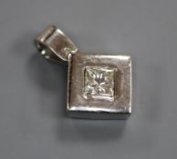 A 'plat' and princess cut solitaire diamond set pendant, overall 17mm.