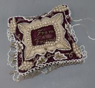 A Victorian velvet and beadwork 'From a Friend' cushion