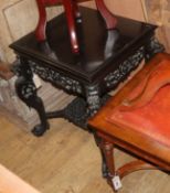 A Chinese carved ebonised occasional table W.58cm