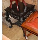 A Chinese carved ebonised occasional table W.58cm