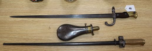 Two bayonets and a powder flask