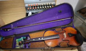 A German early 20th century violin and bow in a walnut inlaid case