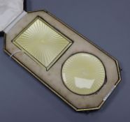 An Adie Bros silver and yellow guilloche enamel cigarette case and compact set, Birmingham 1936,