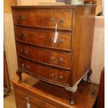 A small reproduction bowfront walnut chest W.62cm