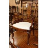 An Edwardian inlaid mahogany open armchair