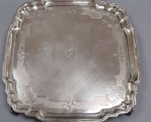 A silver salver with shaped square edge, Goldsmiths & Silversmiths Co Ltd, London 1907, 26.5cm, 23