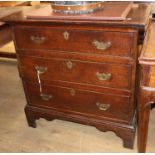 A small George I style oak three drawer chest W.77cm