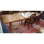 A large pine plank top refectory dining table 305 x 96cm