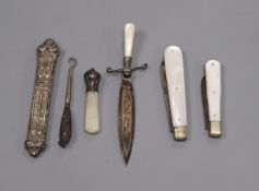 A silver and mother o'pearl book mark, two silver and mother o'pearl fruit knives and two other