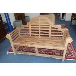 A Lutyens style teak garden bench