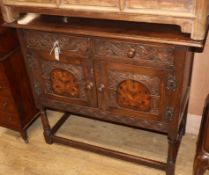 A small 17th century style inlaid oak cupboard W.98cm