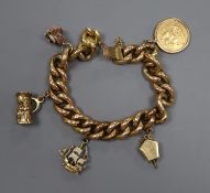 A yellow metal curb-link bracelet (tests as 14ct), hung with a 1905 half sovereign and four