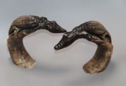 A pair of 'crocodile' horn carvings height 22cm