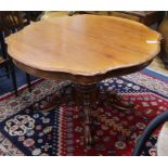 A Victorian mahogany shaped oval dining table L.124cm
