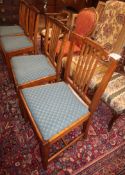 A set of four Sheraton style oak dining chairs, by Waring & Gillow