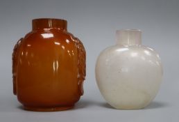 A Chinese agate snuff bottle and an amber glass snuff bottle