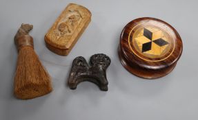 A parquetry box, a carved box, a lion and a Black Forest brush