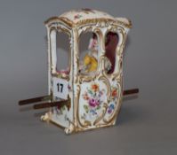 A German porcelain model of a sedan chair, early 20th century, height 13cm