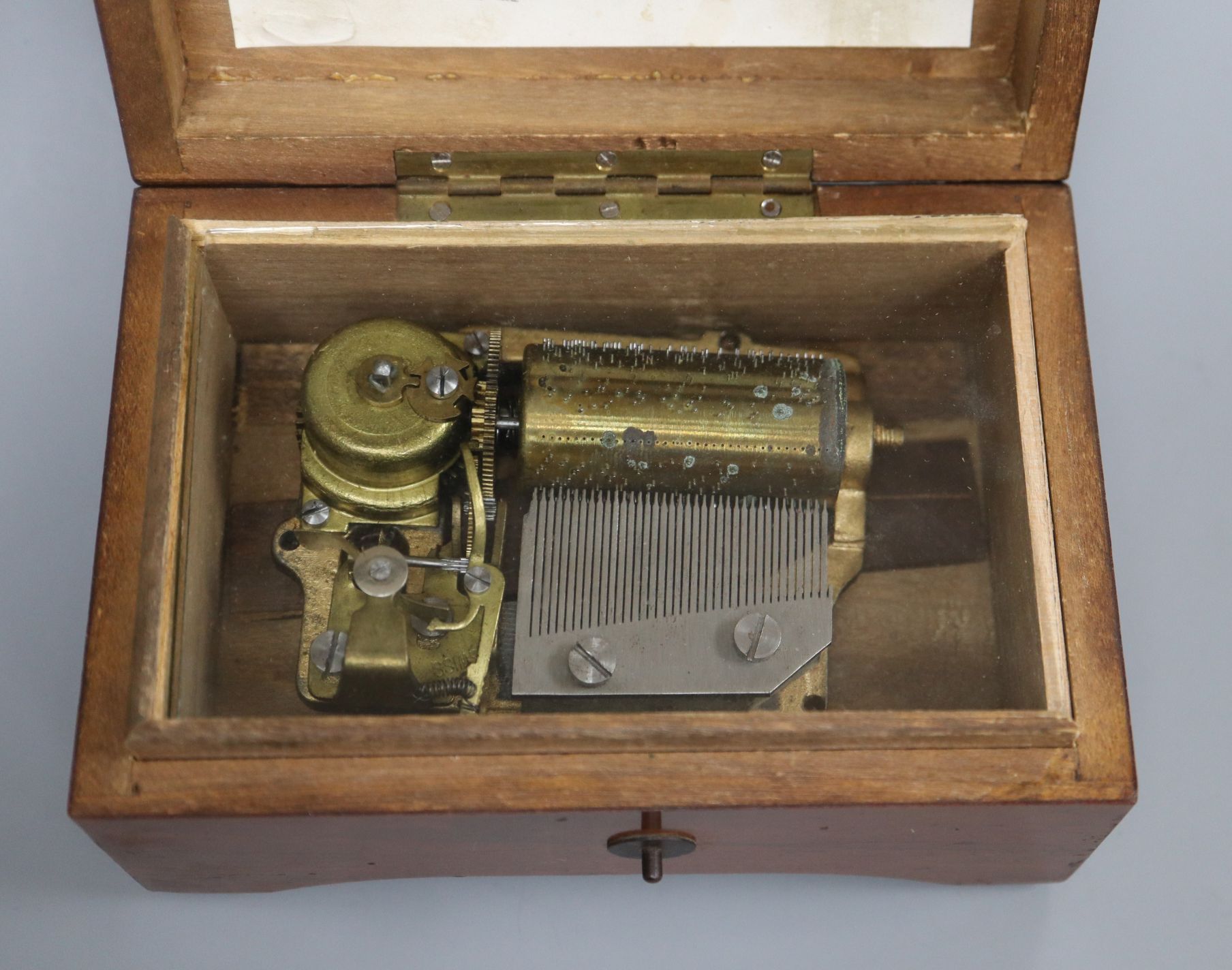 A Swiss walnut cased musical box, playing two airs