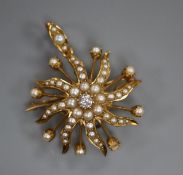 A diamond, seed pearl and gold (tests as 14ct) starburst brooch-cum-pendant (one pearl missing),