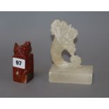 A carved alabaster cornucopia ornament, a carved red soapstone chop height 14cm