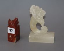 A carved alabaster cornucopia ornament, a carved red soapstone chop height 14cm