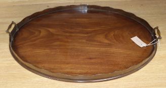 A mahogany oval two handled tray