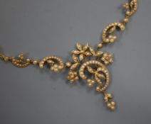 A yellow gold (tests as 18ct) and seed pearl openwork foliate necklace on fancy fine chain,