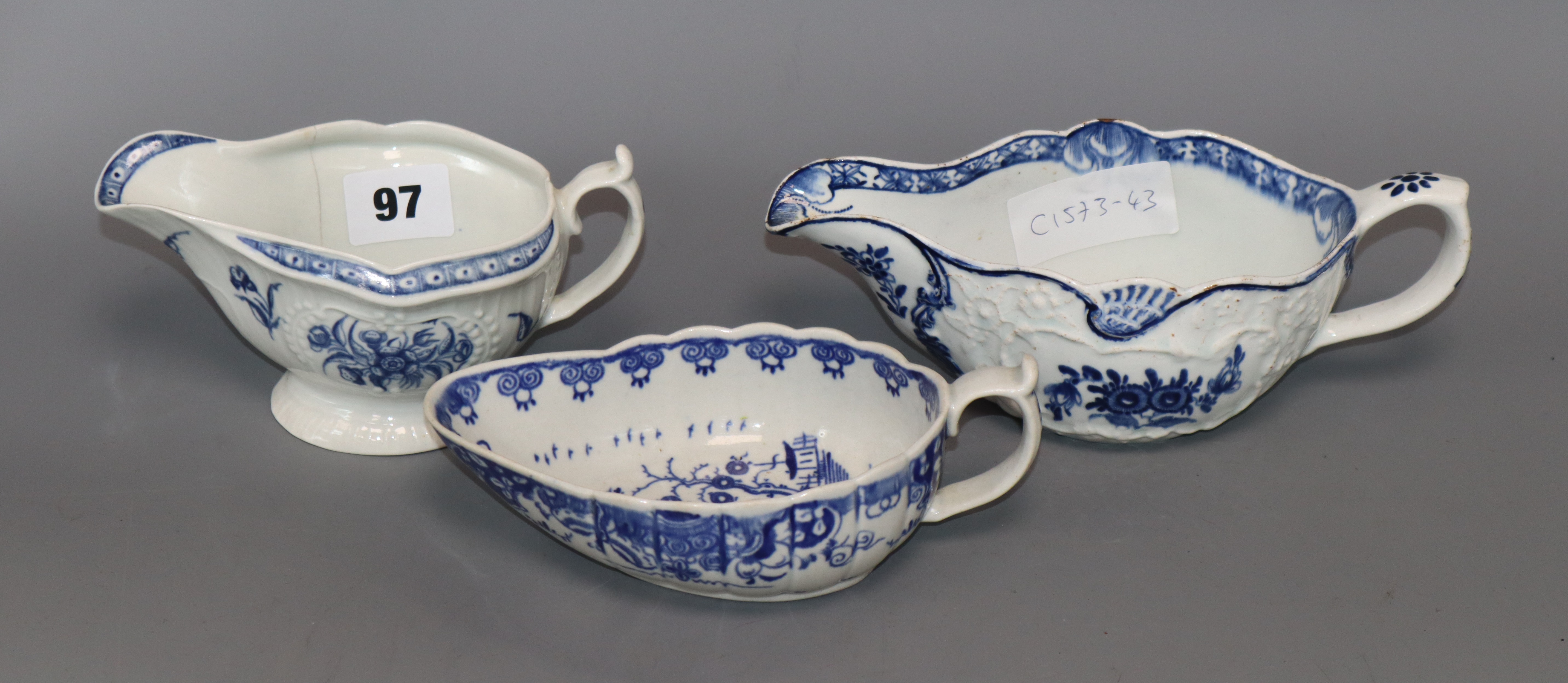 Two Worcester blue and white sauceboats, c.1760-70 and a Bow blue and white sauceboat, c. 1760-5 (
