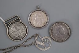 An 800 white metal mounted money clip, a coin set brooch, a coin set pendant, a 925 'initial'