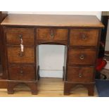 A George III oak kneehole desk W.95cm
