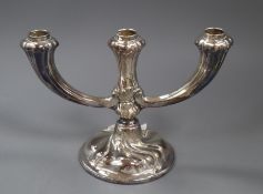 A German 835 standard white metal three light dwarf candelabrum, height 17.7cm.