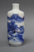 A Chinese underglaze blue and copper red 'landscape' snuff bottle