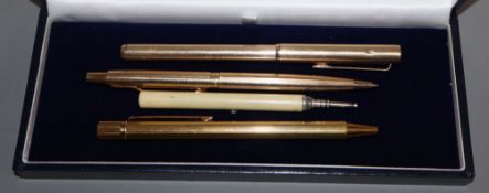 A gold plated Cartier rolled gold Dunhill and Parker Victorian ivory S Mordan and Co. pencil