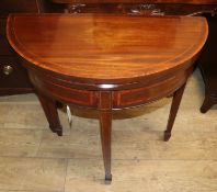 An Edwardian satinwood banded mahogany demi lune folding card table W.73cm